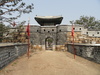 The entrance to Hwaseong Fortress or Suwon Hwaseong. Built between 1794 and 1796, the fortification surrounds the center of Suwon, the provincial capital of Gyeonggi-do, in South Korea. Located 30 km (19 mi) south of Seoul and enclosing much of central Suwon, the fortress includes a palace, Haenggung. The fortress and enclosed palace were designated as a World Heritage site by UNESCO in 1997.