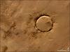 Deep in the Sahara lies a crater, a nearly a perfect circle that is 1.9 km (1.2 mi) wide, and sports a rim 100 m (330 ft) high. The Tenoumer crater sits in a vast plain of rocks so ancient they were deposited hundreds of millions of years before the first dinosaurs walked the Earth. Close examination of the structure has revealed that the crater's hardened "lava" was actually rock that had melted from a meteorite impact.

On this satellite image the crater&amp;apos;s outline is unmistakable, yet it does not necessarily look like a crater; the light and shadows make it look more as if someone pressed a giant cookie cutter into the rock. In this image, the sunlight shines from the southeast (lower right), and the bright arc along the northwestern part of the crater is where the crater walls slope up to the rim. Around the perimeter, the relatively steep walls cast dark shadows. Although it resides in ancient rock, Tenoumer is geologically young, ranging in age between roughly 10,000 and 30,000 years old. Photo courtesy of NASA.
