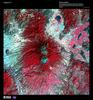 Snow-capped Colima Volcano, the most active volcano in Mexico, rises abruptly from the surrounding landscape in the state of Jalisco in the center of this false-color satellite image. Part of the trans-Mexican volcanic belt, Colima is actually a melding of two volcanoes, the older Nevado de Colima to the north and the younger, historically active Volcan de Colima to the south.  Approximately 300,000 people live within 40 km (25 mi) of the volcano earning it designation as a Decade Volcano by the International Association of Volcanology and Chemistry of the Earth's Interior. Legend has it that gods sit atop the volcano on thrones of fire and ice. For other active volcanoes in Mexico, see the Natural hazards-volcanism subfield in the Geography section. Image courtesy of USGS.