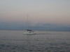 Boat cruising in to Saint Julian's (San Giljan) harbor.