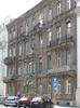 Interesting architectural details in the brick and stone facade of a Warsaw building.