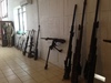 View of the interior of the Peleliu War Museum, which is housed in a former Japanese storage bunker that was used during the Battle of Peleliu (15 September 1944 – 27 November 1944) as command post. The bunker was heavily damaged from the outside by artillery shells fired from the sea. The collection consists of many relics found on the battlefield, such as weapons, helmets, and personal belongings.