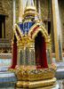 At the Grand Palace in Bangkok; the Palace complex features brightly colored buildings, golden spires, and glittering mosaics.  This close-up highlights the widespread and effective use of mirrored tiles in the construction process.