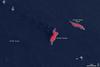 In this earlier satellite view of the islands of Hunga Tonga and Hunga Ha'apai from 14 November 2006, the healthy vegetation appears bright red and Hunga Ha'apai is significantly smaller in size than in the previous image. Photo courtesy of NASA.

