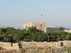 View of the restored castle on Pigeon Island (Guvercin Adasi) in the harbor of Kusadasi. The fortress was the center of the town's activities in the late 19th century. 