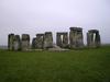 Stonehenge as seen from the north barrow, Wiltshire County, England. The stone circle was built about 2500 B.C. by a non-writing culture and is composed of earthworks surrounding a circular setting of large standing stones with several hundred burial mounds. Among its many suggested functions are that it may have served as: an astronomical observatory, a religious site, a domain of the dead, or a place of healing. The site has also been connected to Arthurian legend.