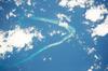 Astronaut photo of Kingman Reef, a largely submerged, uninhabited triangular structure in the North Pacific Ocean, roughly halfway between the Hawaiian Islands and American Samoa. The reef lagoon is 82 m (270 ft) deep at the western part and the total enclosed area is about 76 sq km (29 sq mi).  The east-west and northwest-southeast trending small strips of dry land (gray color) are composed of coral rubble and giant clamshells. The highest point on the reef is less than 1.5 m (5 ft) above sea level, which is awash most of the time, making Kingman Reef a maritime hazard. Image courtesy of NASA.