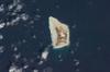 Jarvis Island is an uninhabited 4.5 sq km (1.75 sq mi) coral island located in the South Pacific Ocean. Unlike most coral atolls, the central lagoon on Jarvis is wholly dry; its deep guano deposits were mined for about 20 years during the 19th century. Image courtesy of NASA. 
