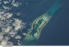 Palmyra Atoll is an unoccupied equatorial Northern Pacific atoll of some 12 sq km (4.6 sq mi) administered by the US Government. It is located almost due south of the Hawaiian Islands, roughly halfway between Hawaii and American Samoa. The atoll consists of an extensive reef, two shallow lagoons, and some 50 sand and reef-rock islets and bars covered with vegetation. The variable temporary population of 4 to 20 "non-occupants" consists of staff and scientists employed by various departments of the US Government and The Nature Conservancy, as well as a rotating mix of Palmyra Atoll Research Consortium scholars pursuing research. Photo courtesy of NASA.
