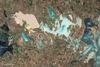 From mainland Ukraine, the Crimean Peninsula extends southward, bordered on the west by the Black Sea and on the east by the Sea of Azov. Stretching across the peninsula is a network of shallow, marshy inlets sprawling over roughly 2,600 sq km (1,000 sq mi). This network of lagoons is known as Syvash (also Sivash or Sivas). During the summer months, the warmed marsh waters give off unpleasant odors, lending the region the nicknames of "Rotten Sea" or "Putrid Sea."
This natural-color satellite image shows the shallow waters and varied chemical composition of the Syvash lagoons contribute to their unearthly colors of peach, mustard, lime green, blue, blue-green, beige, and brown. Thick layers of silt coat the bottoms of the shallow marshes, which are rich enough in mineral salts to supply a local chemical plant.
Surrounding the marshy areas are mostly agricultural fields. Urbanized areas appear along the shores of the Black Sea, and highways curve and zigzag across the peninsula. Outside of the marshes, the land in this area is generally a level plain of arid steppe. In colder months, frosts alternate with thaws, and fogs are frequent. Photo courtesy of NASA.