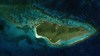View of Buck Island Reef National Monument from space. Image courtesy of NASA. Located 2.4 km (1.5 mi) northeast of the island of Saint Croix, Buck Island Reef National Monument includes over 7,700 ha (19,000 acres) of both submerged and dry lands. On land, trails on Buck Island wind through tropical dry forests, a manchineel beach forest, pristine sand beaches, and rocky shores. The beaches are home to several endangered and threatened species, such as hawksbill, green, leatherback, and loggerhead sea turtles, and the Saint Croix Ground Lizard. Every summer, least terns arrive to nest, followed by pelicans in the fall. Elkhorn coral surrounds two-thirds of the island. 