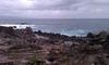 Kapalua Beach Trail on the island of Maui. The trail runs for 2.8 km (1.8 mi) along the Kapalua coast, passing white sand beaches, stunning homes, and lava flows, as shown in this picture.