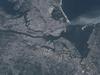 Visible from space, a smoke plume rises from the Manhattan area after two planes crashed into the towers of the World Trade Center. This photo was taken of metropolitan New York City (and other parts of New York as well as New Jersey) the morning of 11 September 2001. Image courtesy of NASA.


