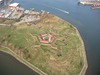 Aerial view of Fort McHenry National Monument and Historic Shrine in Baltimore, Maryland showing the entire tip of Locust Point. The fort is best known for its role in the War of 1812, when it successfully defended Baltimore Harbor from an attack by the British navy on 13-14 September 1814. The flying of the fort’s larger American garrison flag on the morning of the 14th following 25 hours of continuous bombardment signaled American victory and inspired Francis Scott Key to compose the poem “Defence of Fort M’Henry” that was later set to music and became known as “The Star Spangled Banner,” the national anthem of the United States. Photo courtesy of the National Park Service.
