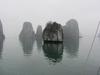 Ha Long Bay in northern Vietnam near the border with China and 170 km east of Hanoi. The bay, which is a World Heritage site,  has 1,969 monolithic limestone islands rising from the water many topped with vegetation. 