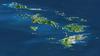 St. Thomas, St. John, Tortola, and Virgin Gorda are the four main islands (front to back) in this east-looking view of the US Virgin Islands and British Virgin Islands. For this view, a nearly cloud-free Landsat image was draped over radar elevation data, and shading was added to enhance the topographic expression. Elevation is shown with 1.5x scaled vertical exaggeration. Coral reefs fringe the islands in many locations and appear as very light shades of blue. Tropical vegetation appears green, while developed areas appear in shades of brown and white. Image credit: NASA, JPL, and NIMA. 