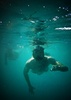 Personnel from US Navy Support Facility Diego Garcia participate in a Morale, Welfare, and Recreation snorkeling excursion in the lagoon. The island lagoon offers an ideal sheltered body of water for a variety of water sports. Photo courtesy of the US Navy/ Mass Communication Specialist 3rd Class Alex Smedegard.